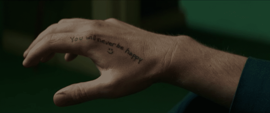 you will never be happy tattoo - Holland March (Ryan Gosling), The Nice Guys