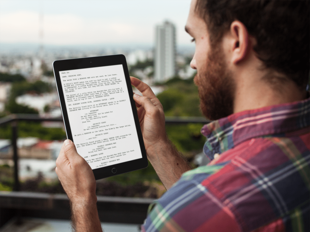 man reading movie script by Industrial Scripts. screenwriting newsletter.